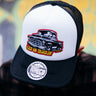 TOXICO Keep On Truckin’ Trucker Hat with white front, black mesh and peak, vintage pickup artwork and yellow lettering.